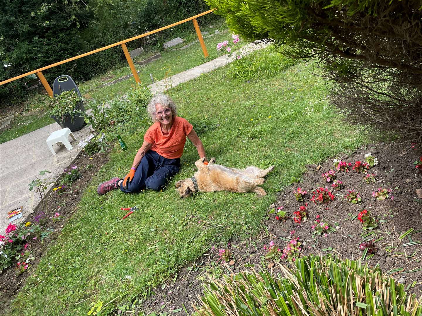 Beryl Thompson who looks after the gardens, pictured with Charlie