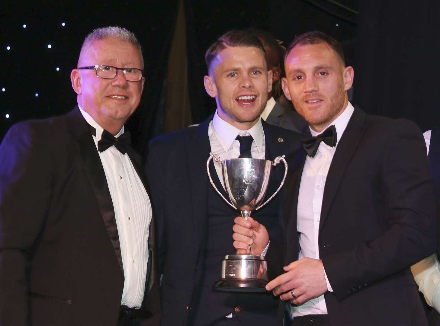 Gills chairman Paul Scally, last season's POTY Mark Byrne with the 2018/19 winner Barry Fuller Picture: GFC/Kent Pro Images