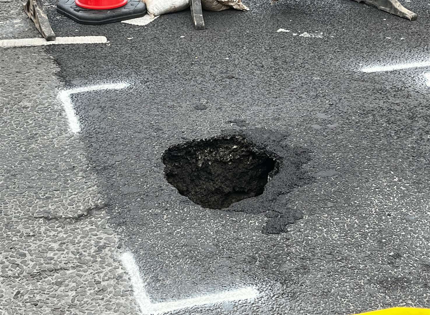 A deep hole has appeared in the carriageway on High Street, Swanscombe