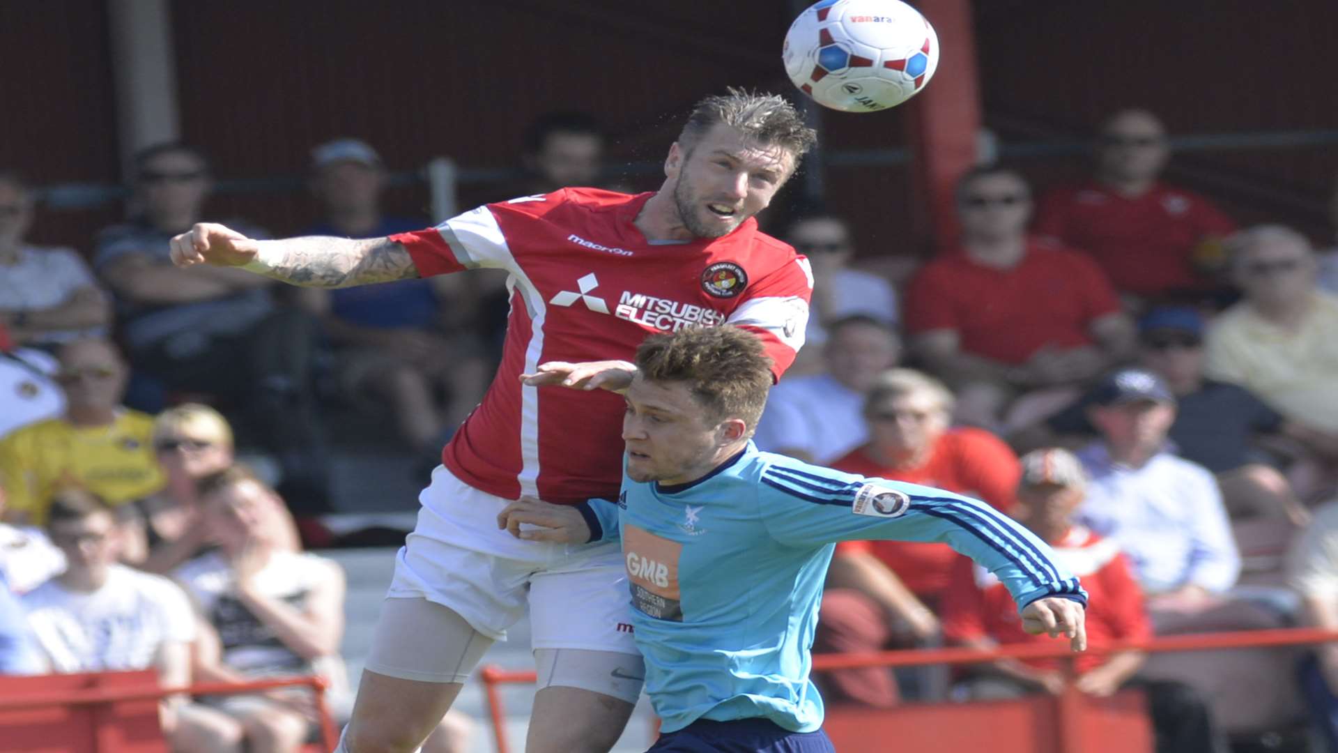 Dean Pooley wins this header in the play-off semi-final against Whitehawk Picture: Ruth Cuerden