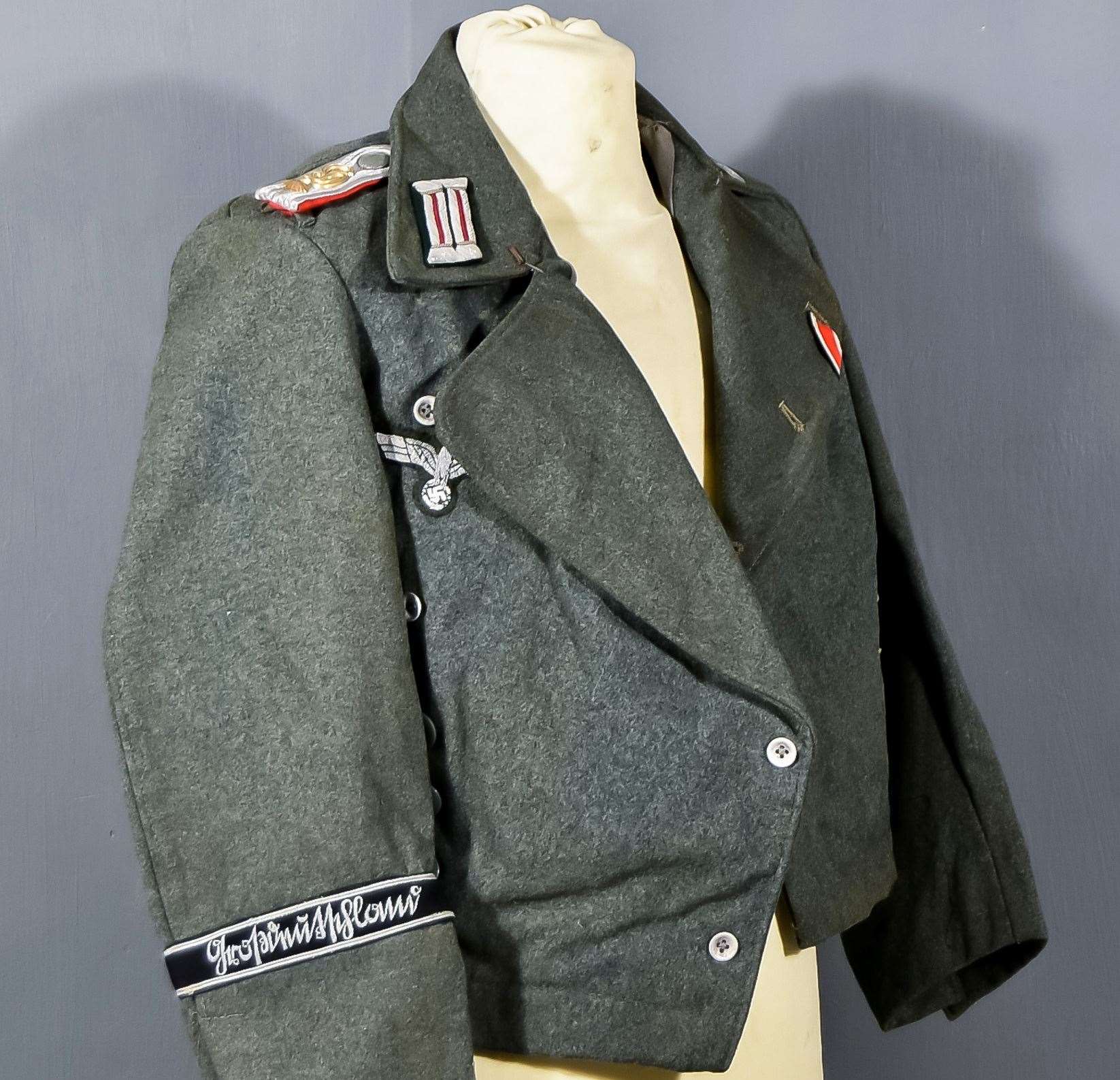 A Panzer Regiment field tunic bearing a swastika on one sleeve