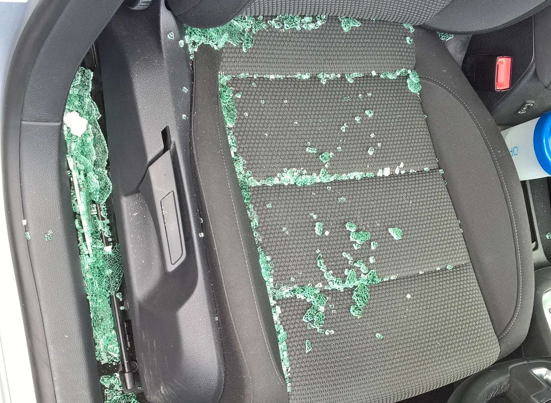 The driver’s side window was shattered
