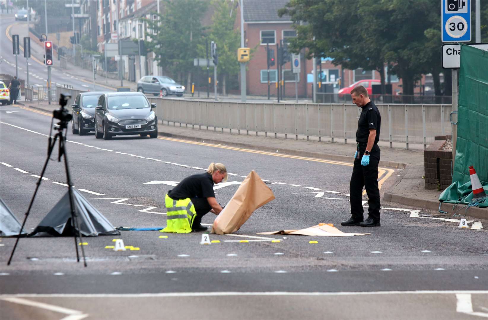 Police at the scene of a crash in New Road, Chatham. Images: UKNiP
