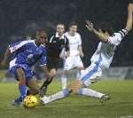 Roger Johnson dives into a tackle on Darren Byfield. Picture: ANDY PAYTON