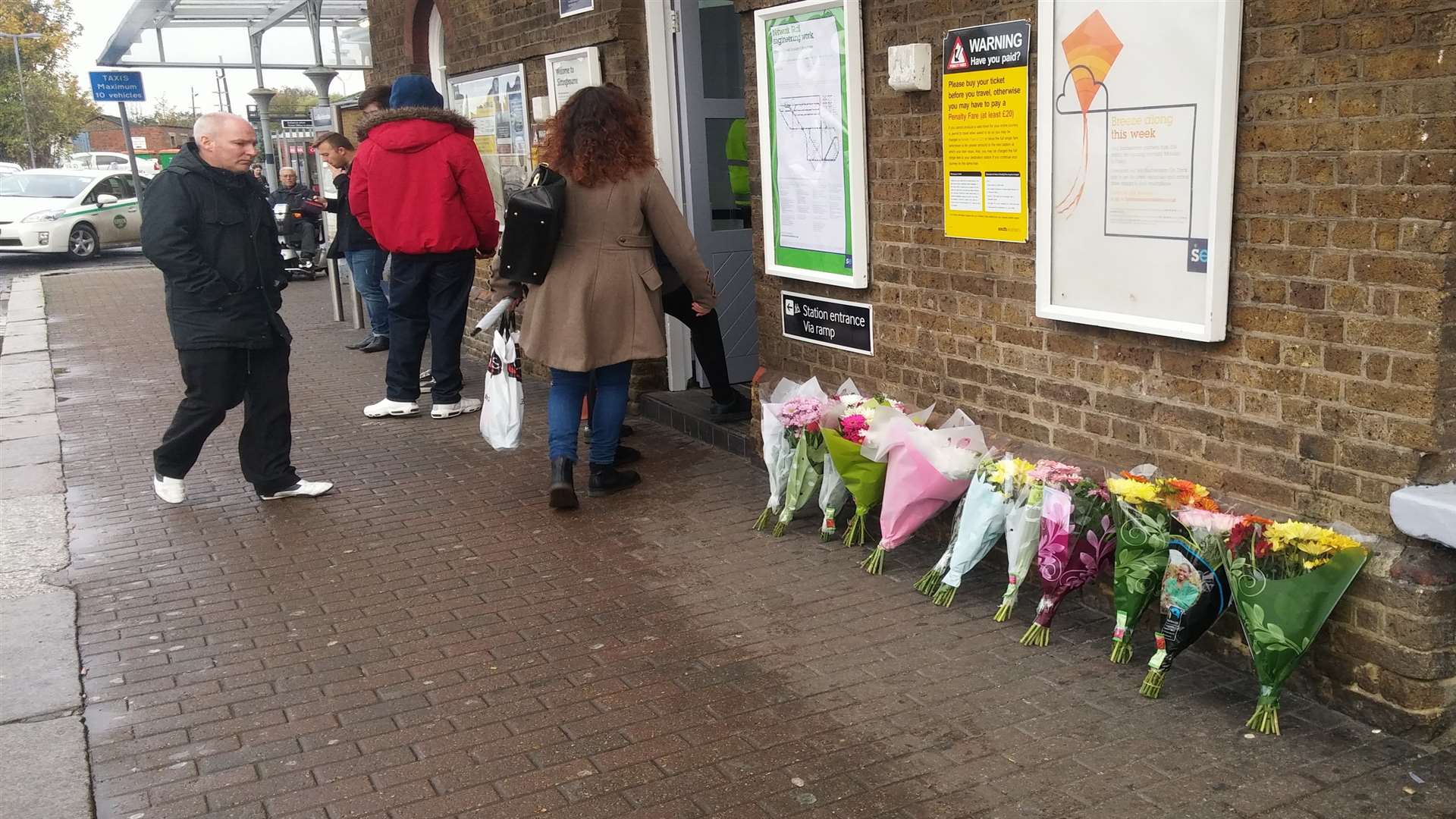 Flowers laid outside Sittingbourne train station for Sophie Lintott