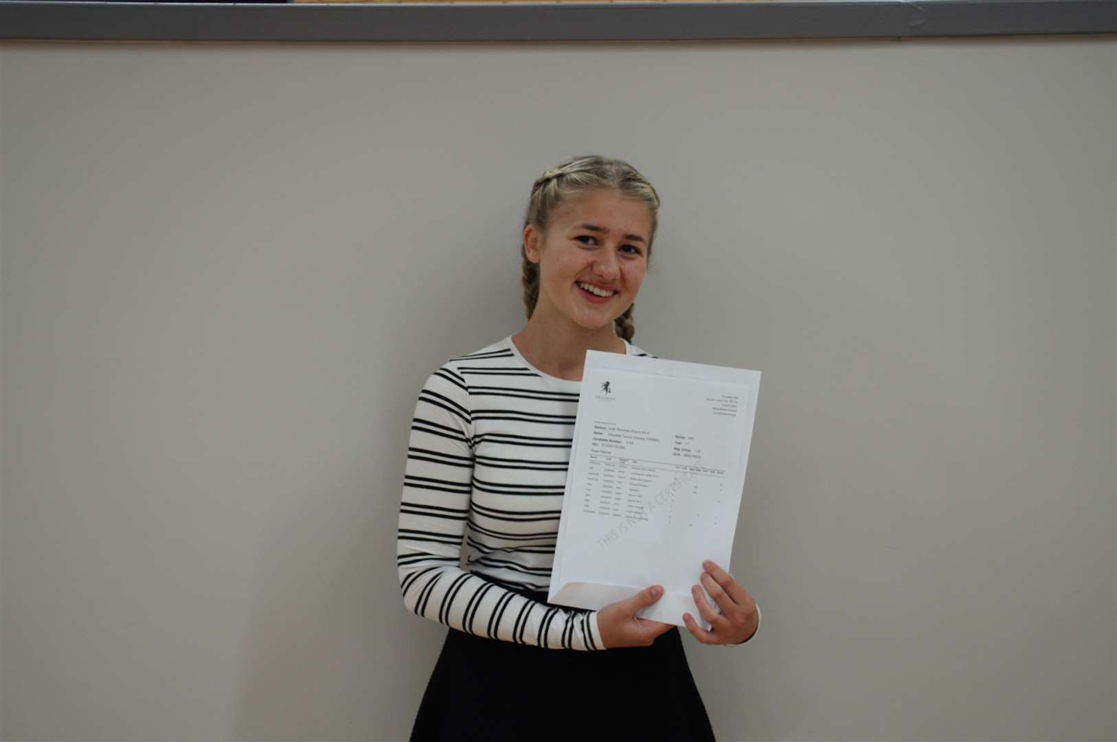 The Lenham School's Charlotte Tyrrell who achieved: Business Studies Distinction *, Design & Technology 7, Double Science 8-8, English Lang. 7, English Lit. 9, Geography 8, German 5, Spanish 7, Sports Studies 6 (15612399)