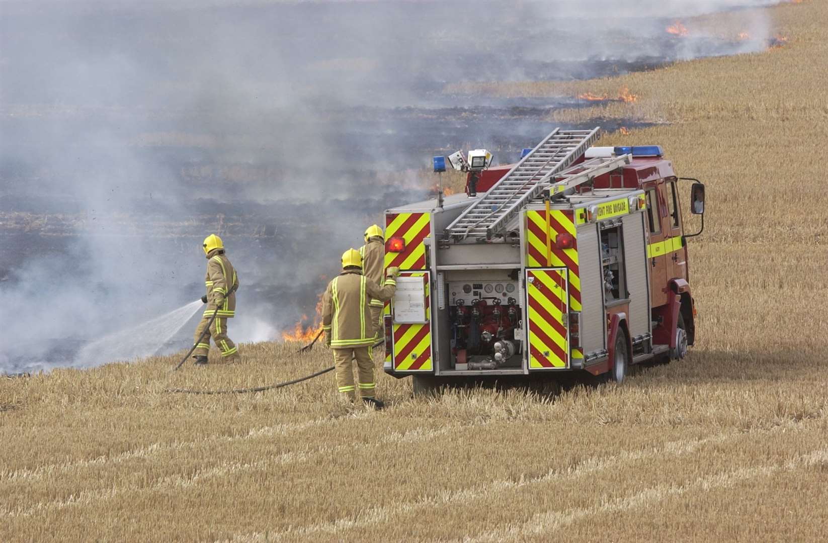 Firefighters tackle a stubble fire. Stock pic