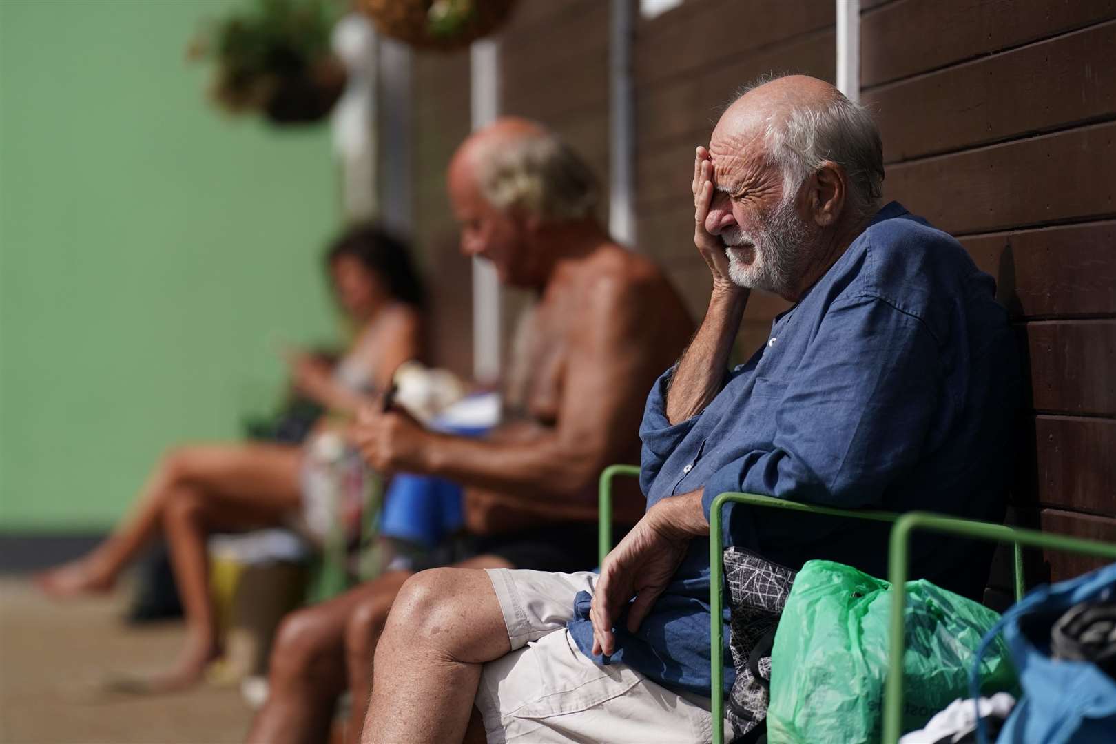 People enjoying the sunshine at the lido (Joe Giddens/PA)