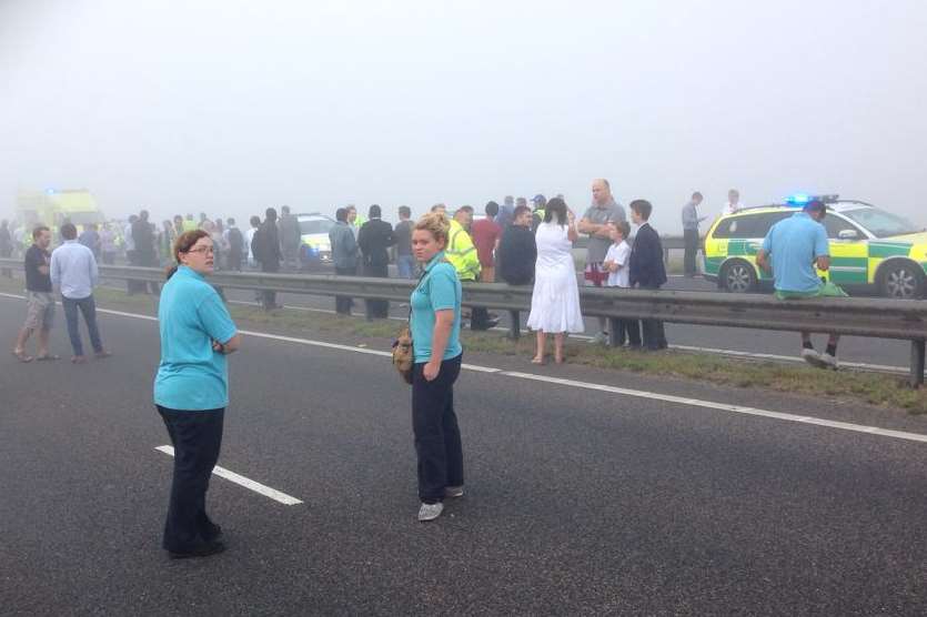 Motorists and passengers on the Sheppey Crossing after the pile-up. Picture: Gary Jeal