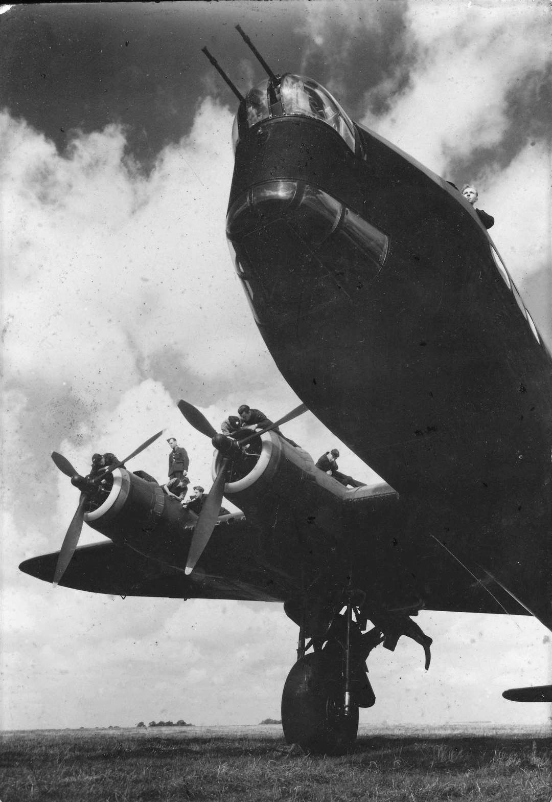 A Stirling bomber being worked on by ground crew. The Stirling, developed by the Rochester company Short Bros, was the first four engine bomber to take to the air. Later in the War it was used as a glider tug