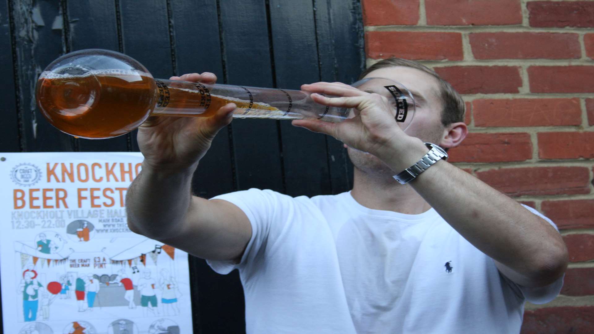 A reveller at last year's festival drinks a yard of ale