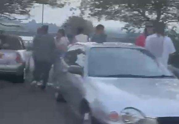The video shows a number of young drivers gathering in the car park during the evening