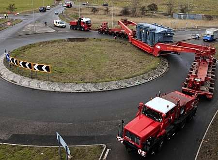 The huge load negotiates a roundabout near the Sheppey crossing during last week's journey. Picture: Mike Mahoney