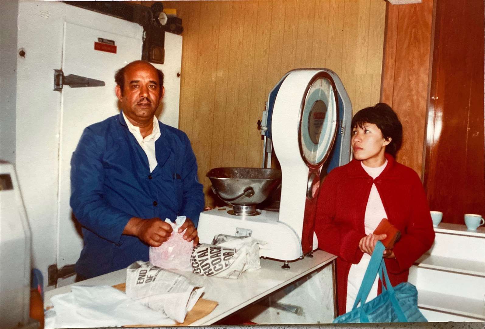 Hakim Hussain serves a customer