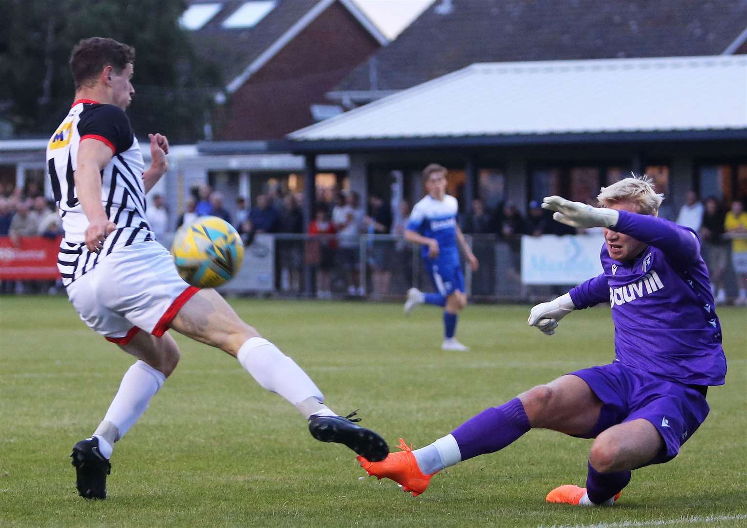 Max Niblett, of Deal, is denied by Gillingham keeper Taite Holtam. Picture: Paul Willmott