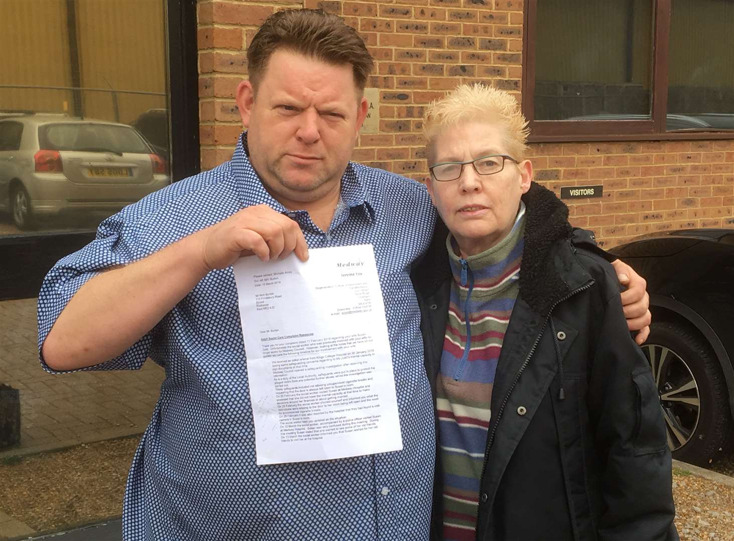 Nick Burton, pictured with wife Sue Judd, says he was treated as a suspect and threatened while social services investigated safeguarding concerns after she fell down the stairs