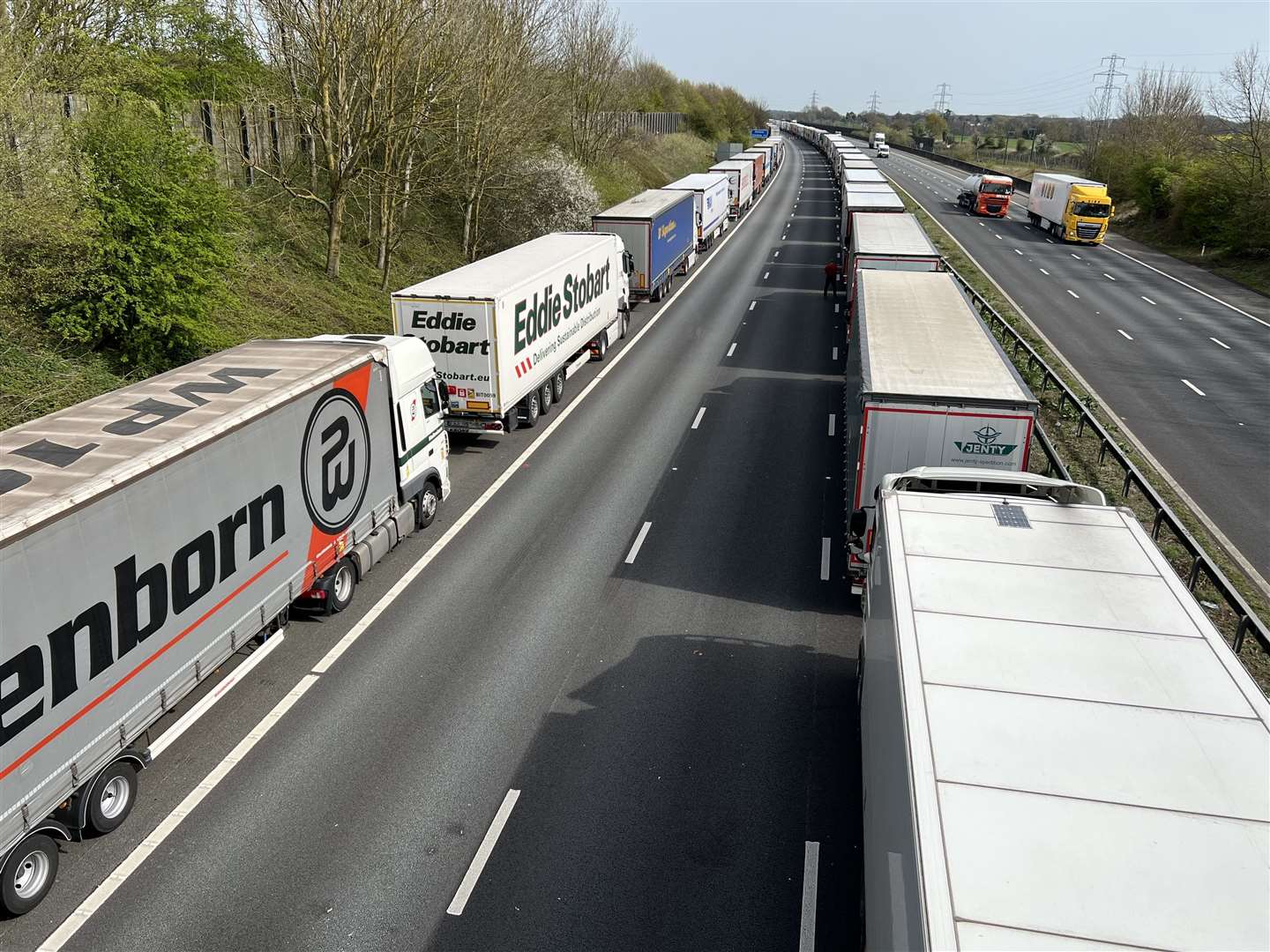 Lorries queue on the M20 motorway near Sellindge, as part of Operation Brock. Picture: Barry Goodwin