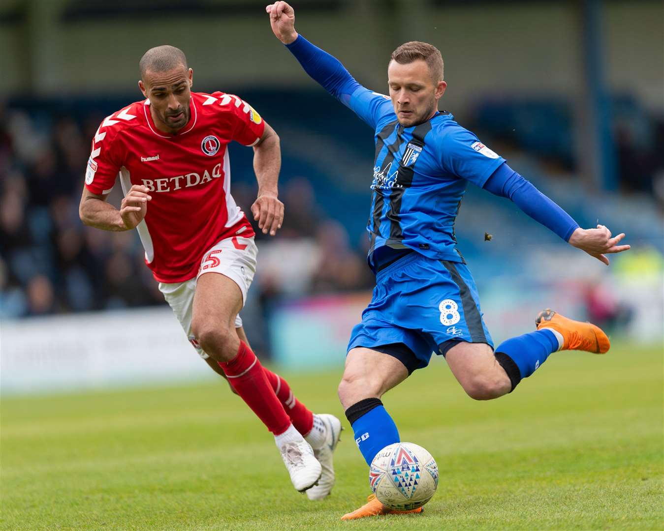 Dean Parrett gets a shot away against Charlton, watched by Darren Pratley Picture: Ady Kerry