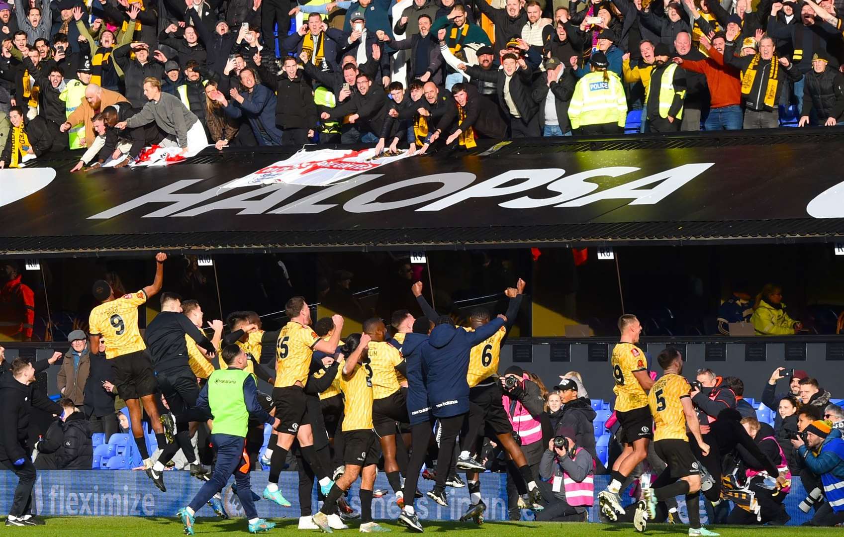 Maidstone players celebrate with their fans after a historic FA Cup upset against Ipswich Town. Picture: Steve Terrell