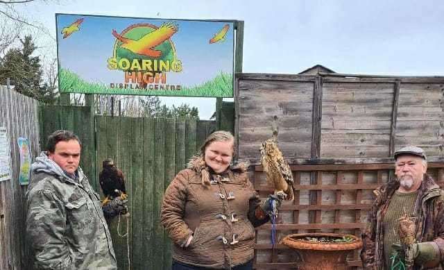 From right to left: Gary Roots with his Kestrel, Sylvia How with an Eagle owl and Gary's son, Tom, with a Harris Hawk