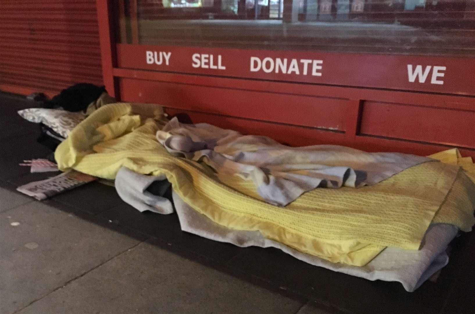 A mattress and blankets outside Entertainment Exchange in Canterbury