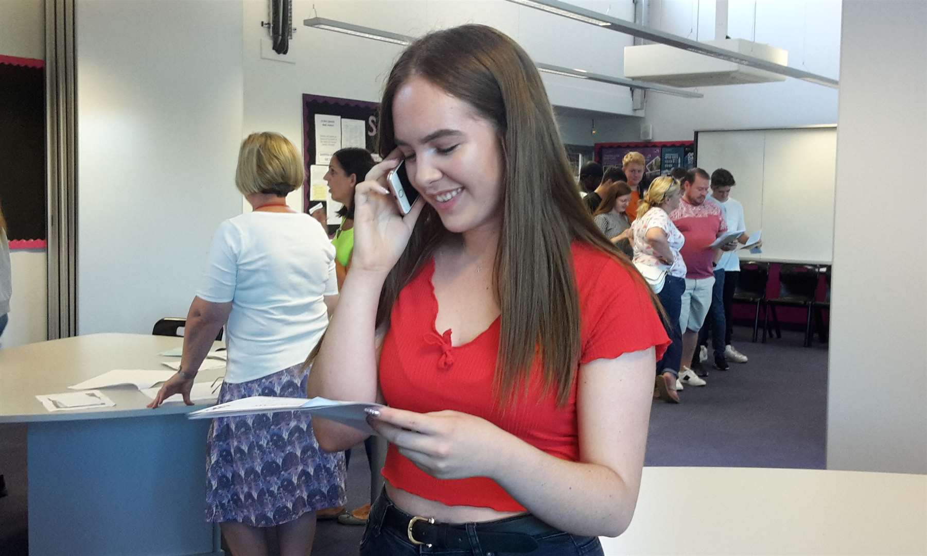 Katie Adams at Fulston Manor on the phone to her mum after passing all her exams