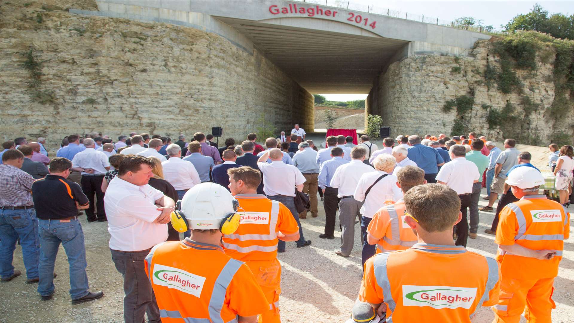 Employees and customers gather to see the boss Pat Gallagher open the tunnel