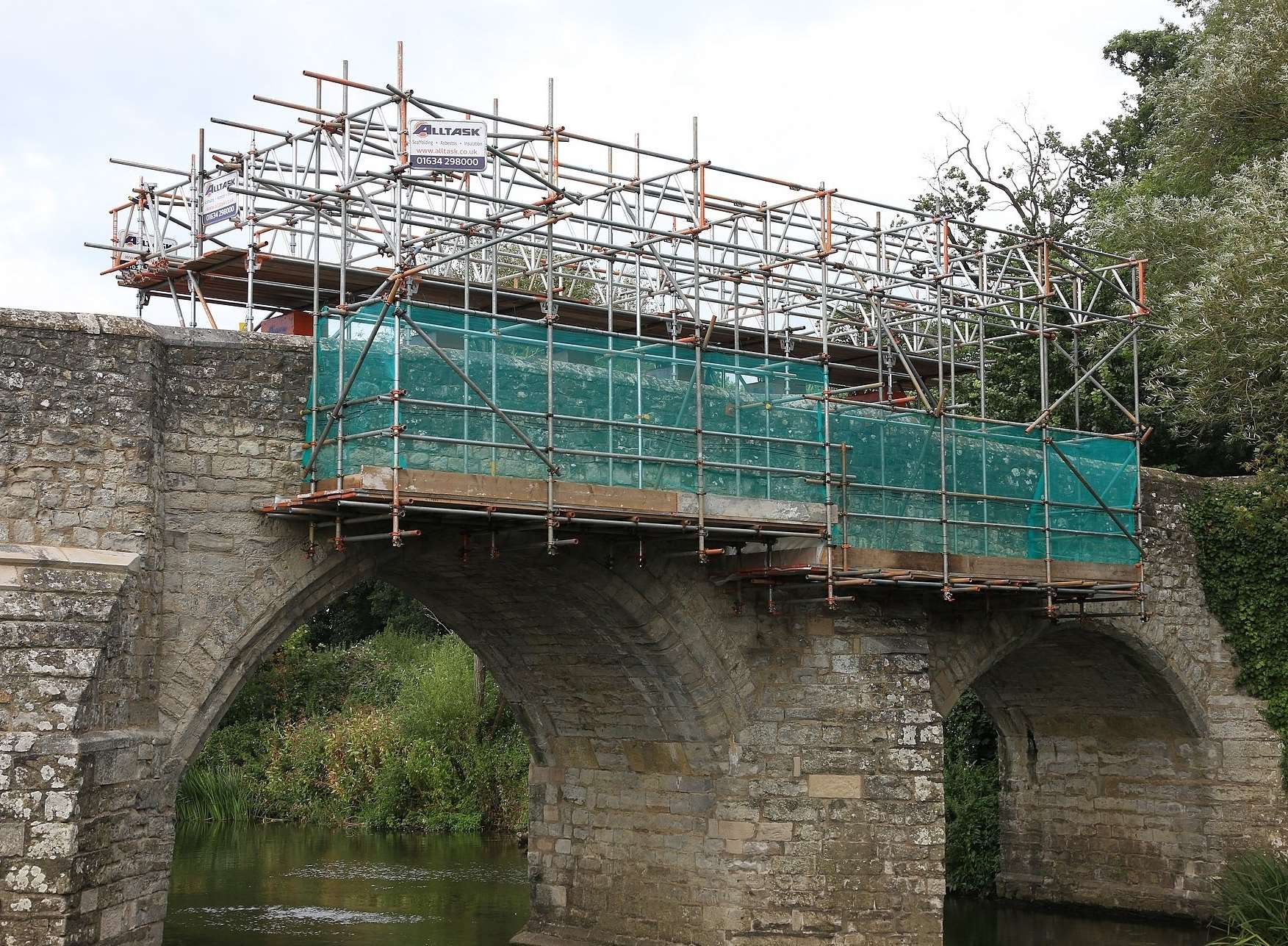 Images of scaffolding being constructed at Teston Bridge so workmen can begin repairs after it was hit by a car. Pictures: Mike Mahoney.