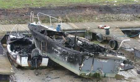 The burned-out boats in Queenborough Harbour. Picture: MIKE SMITH