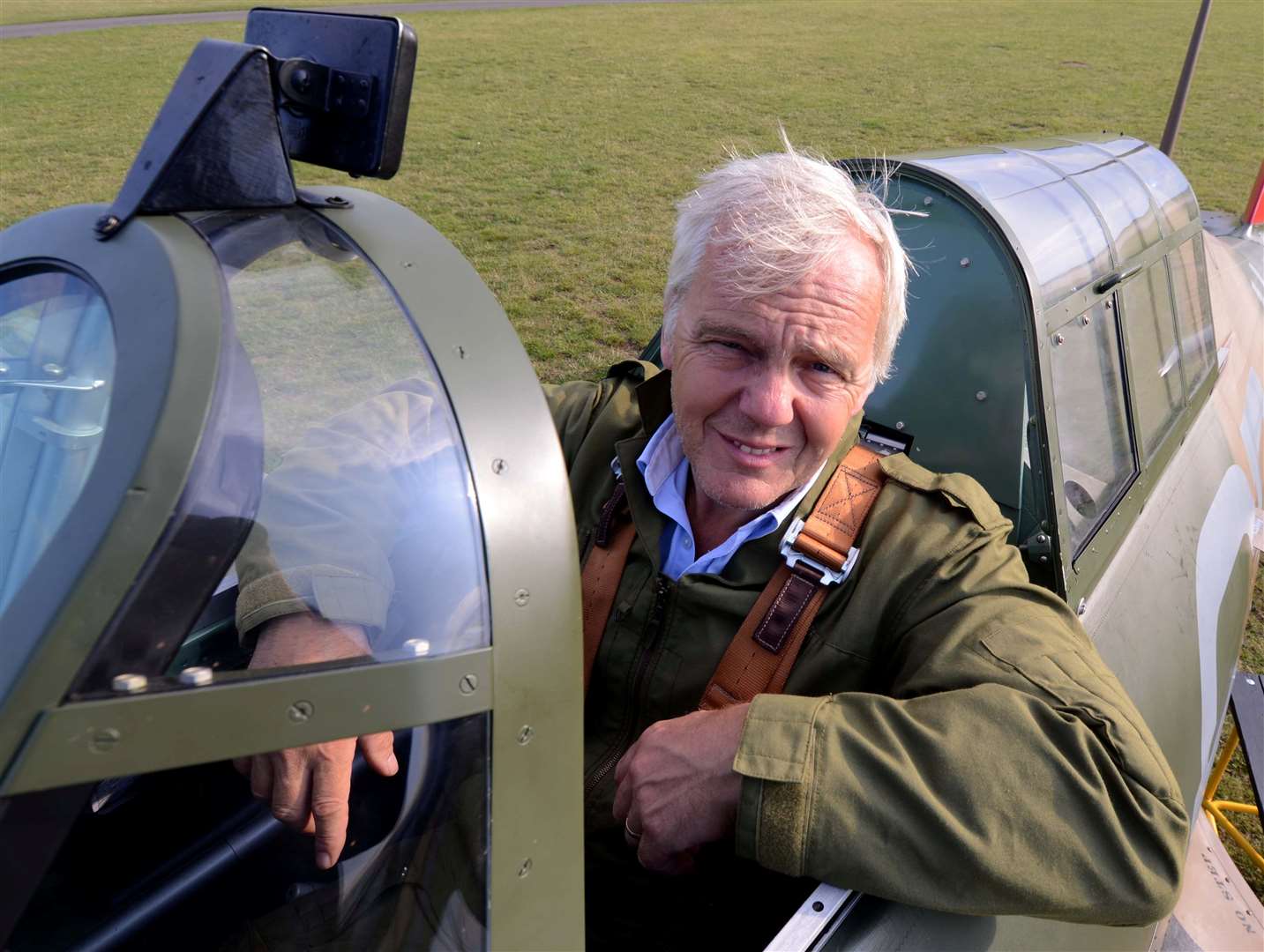 Neurosurgeon Peter Kirkpatrick, 57, sits proudly in the cockpit of his newly restored Mk1 Hawker Hurricane. Picture: SWNS