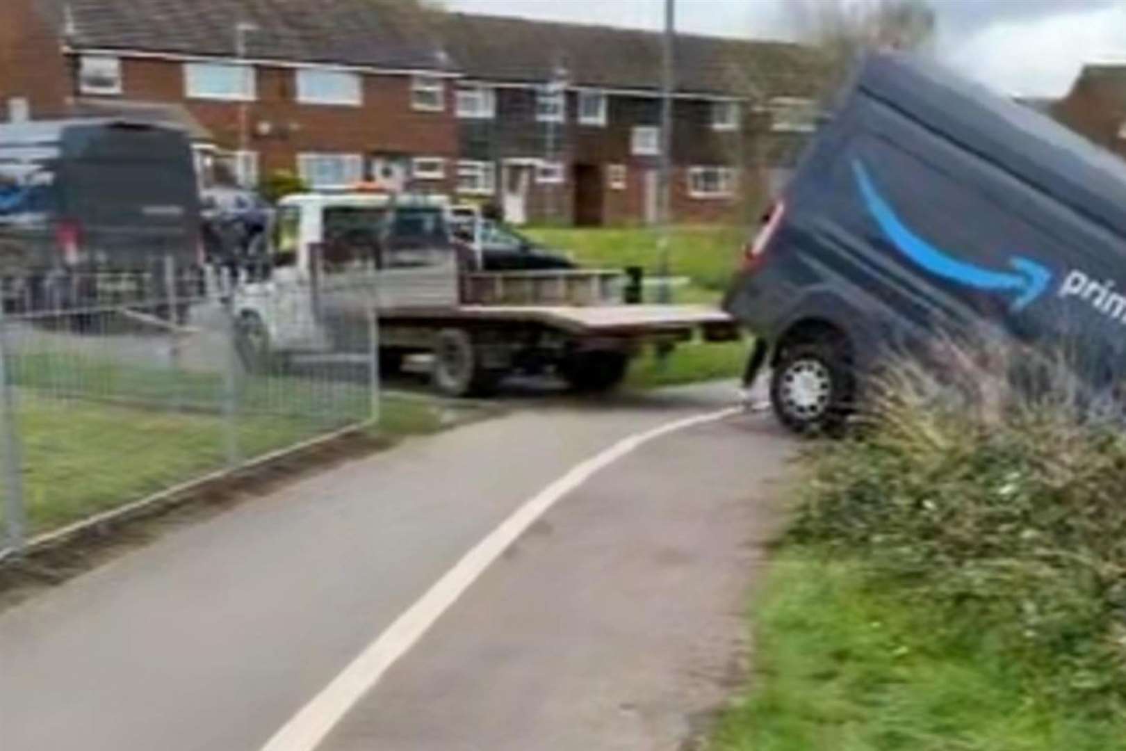 Two other vehicles have been seen trying to get the van back on the road. Picture: James Hazeldon