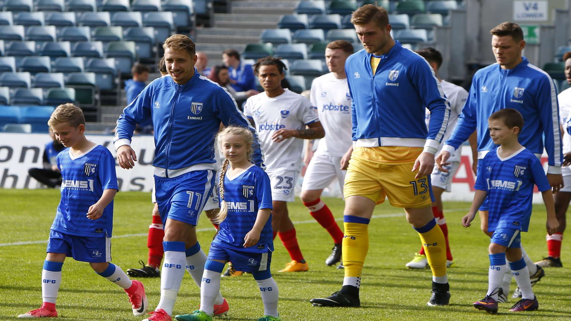 Skipper Lee Martin leads the Gills out to face Portsmouth Picture: Andy Jones