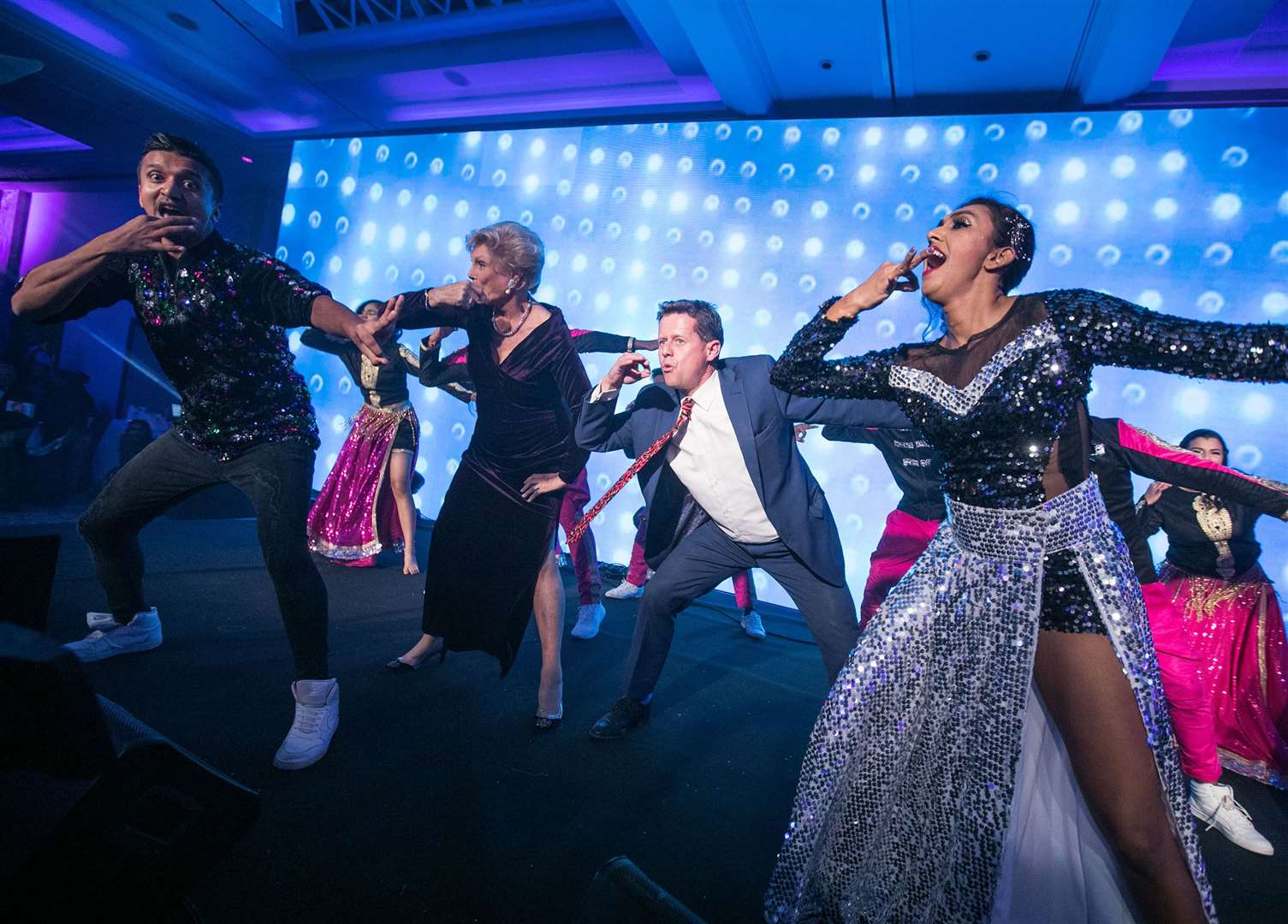 Bollywood dancers with television presenters Mike Bushell and Angela Rippon at the Curry Life Awards event. Photo: Curry Life Magazine