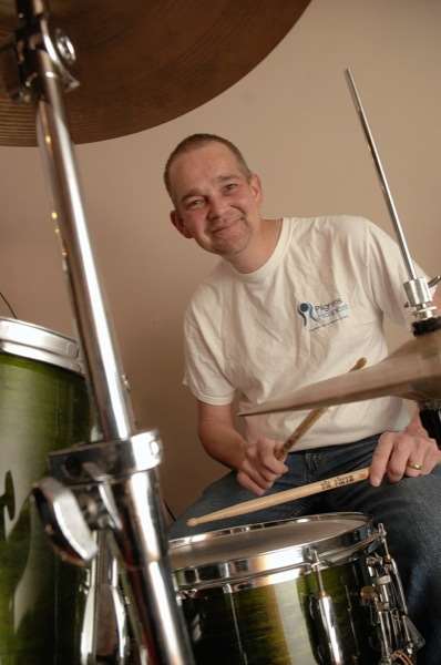 Ian Mitcheson playing drums