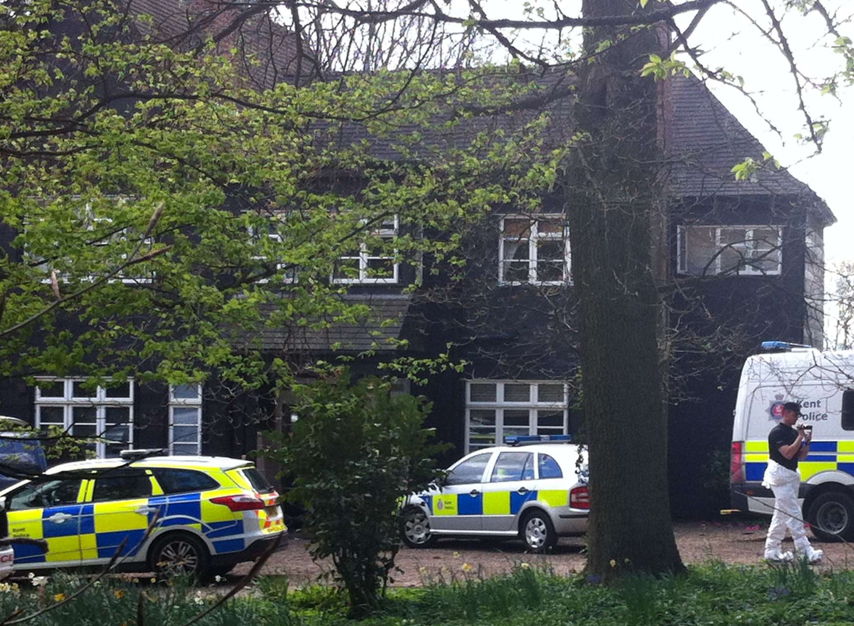 Police take pictures in the grounds of Peaches Geldof's home. Picture: Kiran Kaur