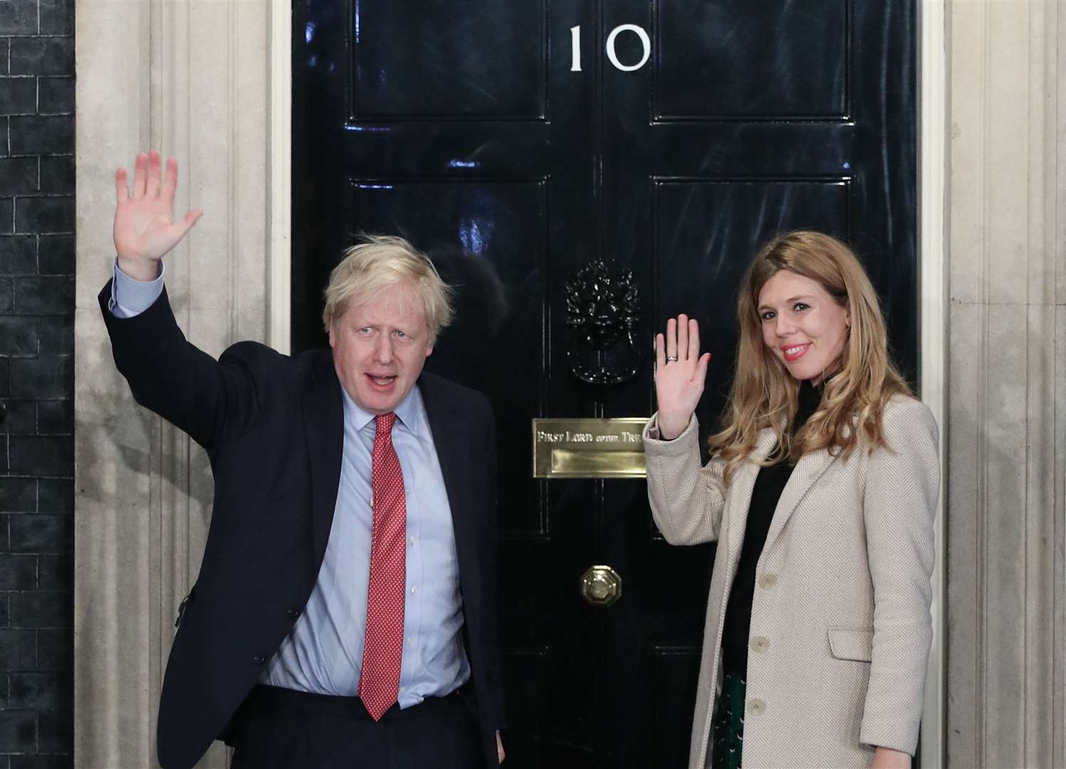 Mr Johnson and his girlfriend Carrie Symonds arrive in Downing Street after the landslide victory in the 2019 general election (Yui Mok/PA)
