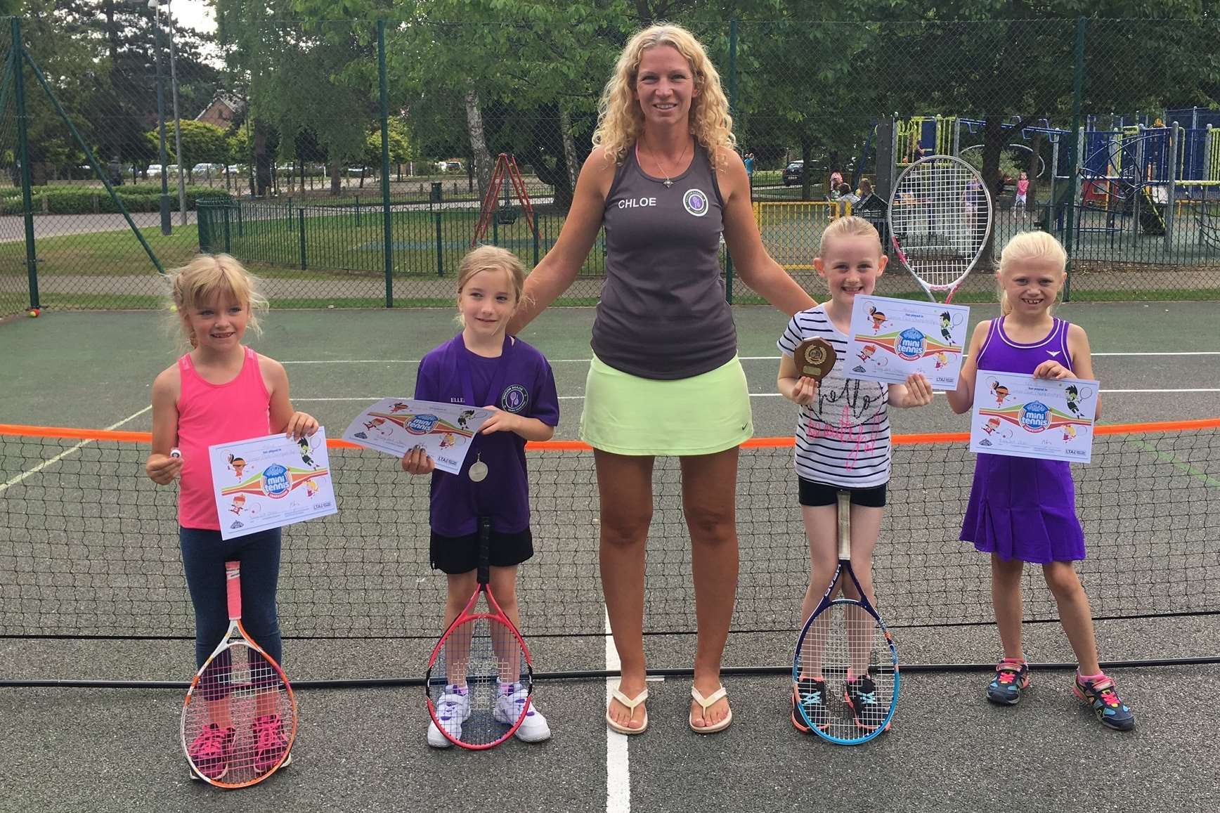 Club founder Chloe Ayling with youngsters at Kings Hill Community Tennis Club