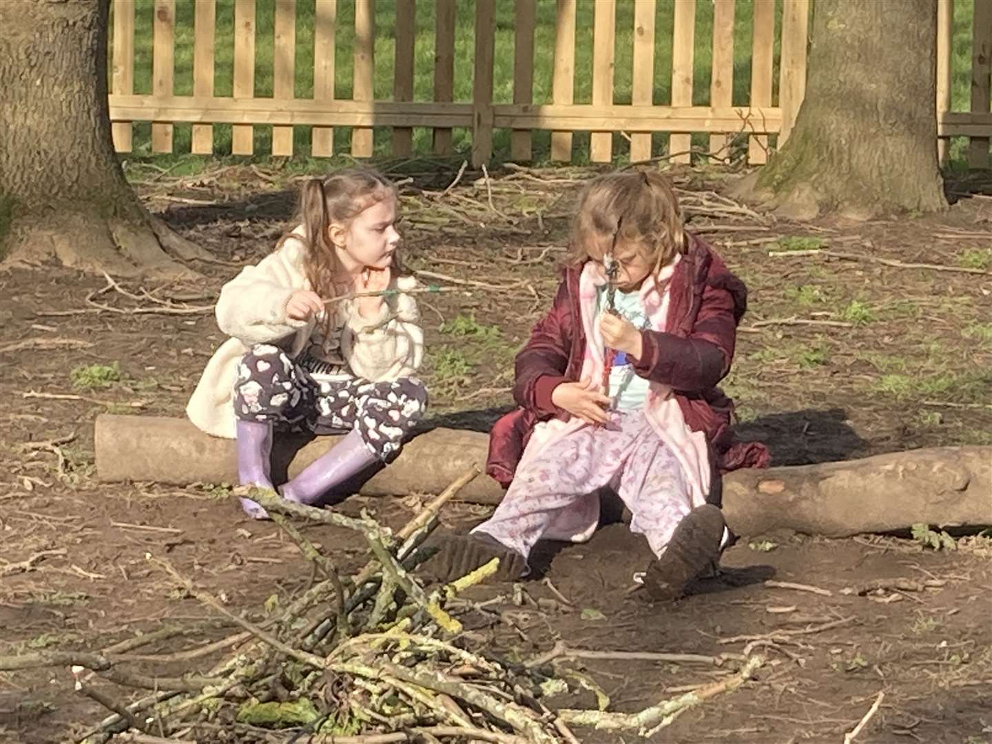 Stick talk during forest school at Sunny Bank Primary School