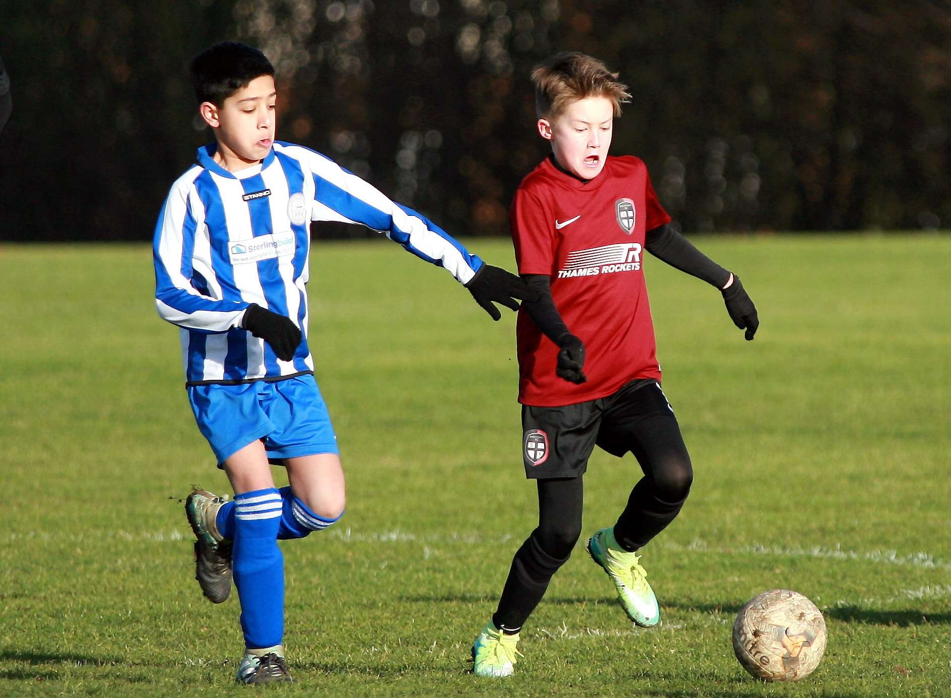 Chatham Riverside under-12s give chase against Strood United Picture: Phil Lee