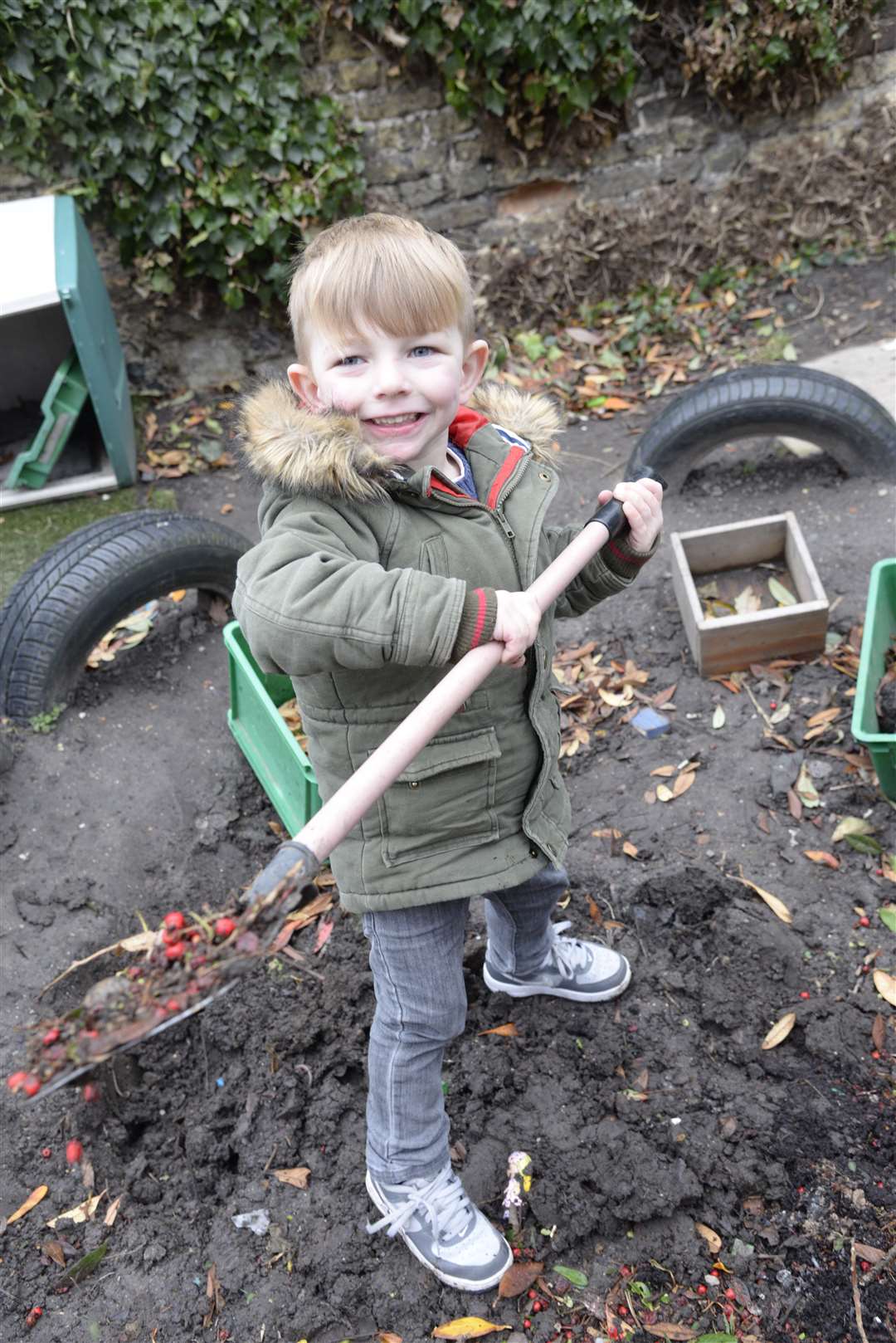Joseph Kingsland, three, at work in the garden of School House Nursery