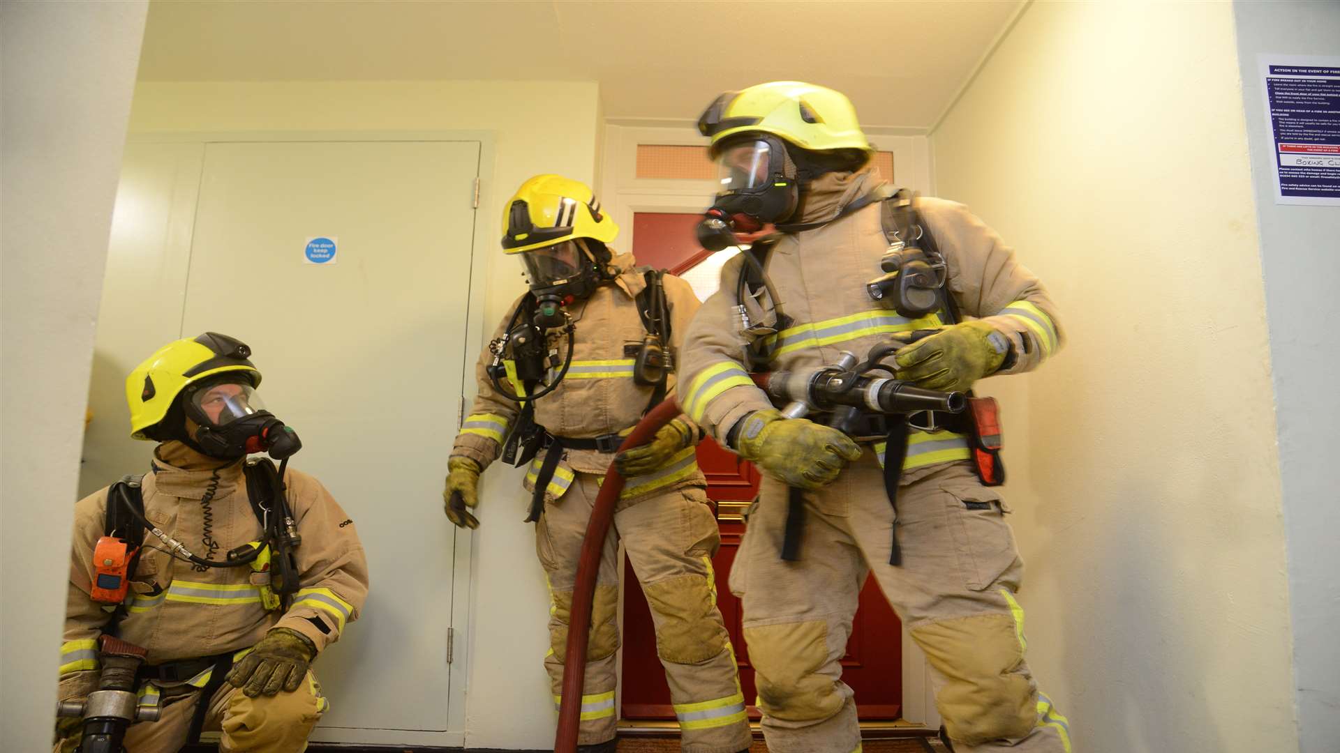 Crews with breathing apparatus in action on the 14th floor.