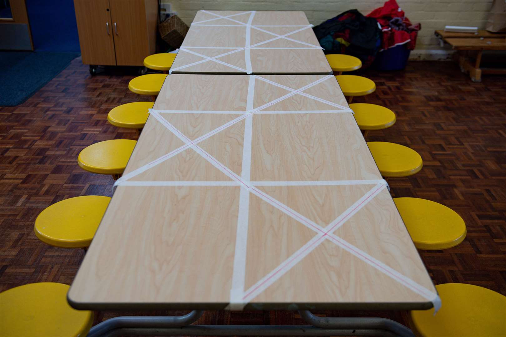 Tables are marked showing where children can sit during dinner time (Jacob King/PA)