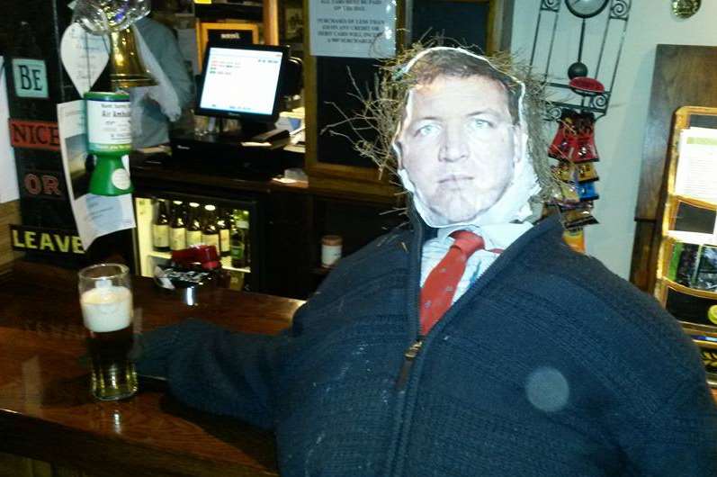 'Damian Collins' sipping on a pint before he is put to the pile at Stanford's bonfire night on Friday. Picture: Matthew Webb/Facebook