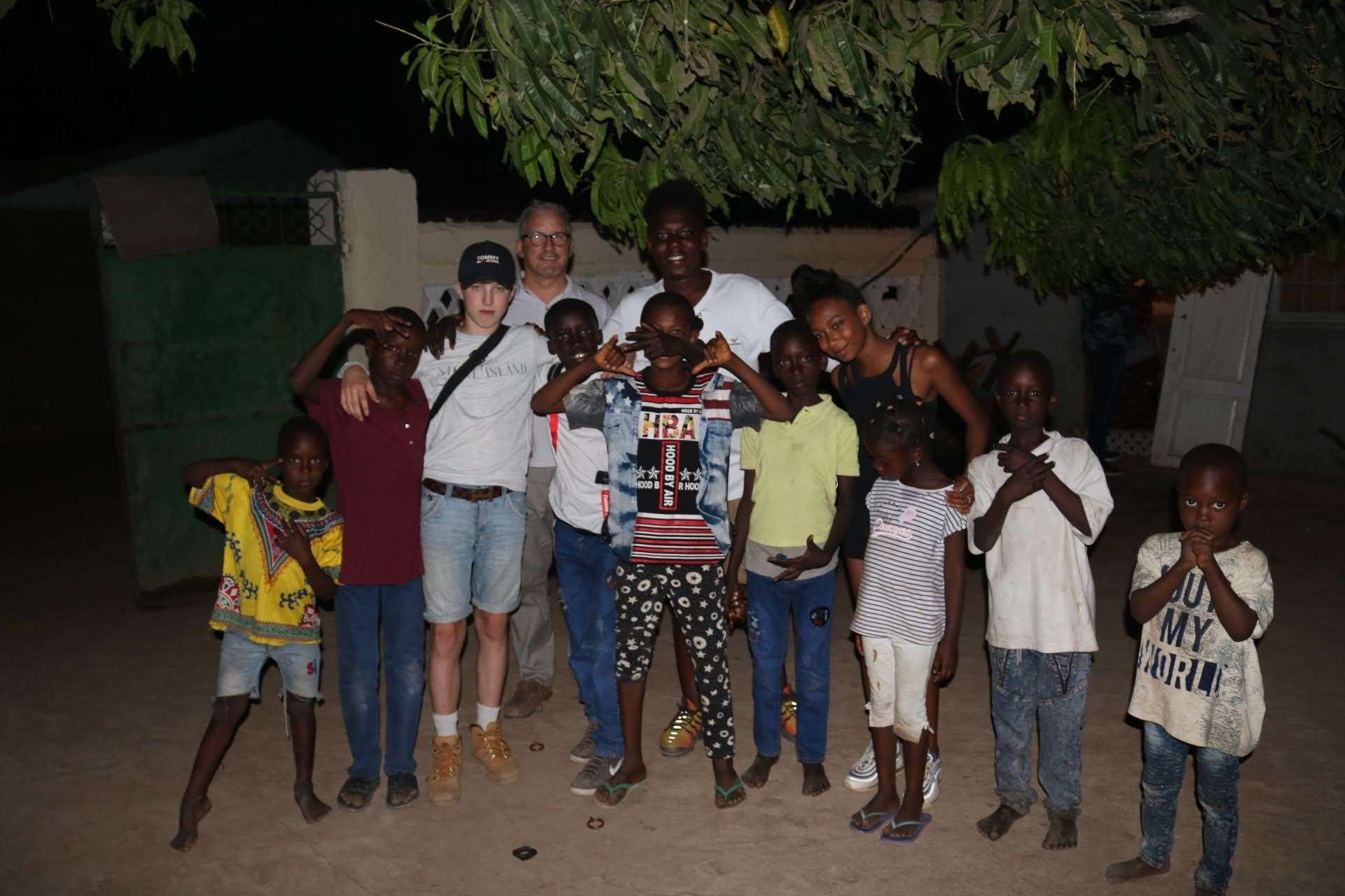 Adam, Francis, Kanye and Kalila with some of the local children in Gambia