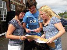Laura Golding, 17, Matthew Knell, 17, and Jessica Gray, 17, at Borden Grammer School check out each others results.