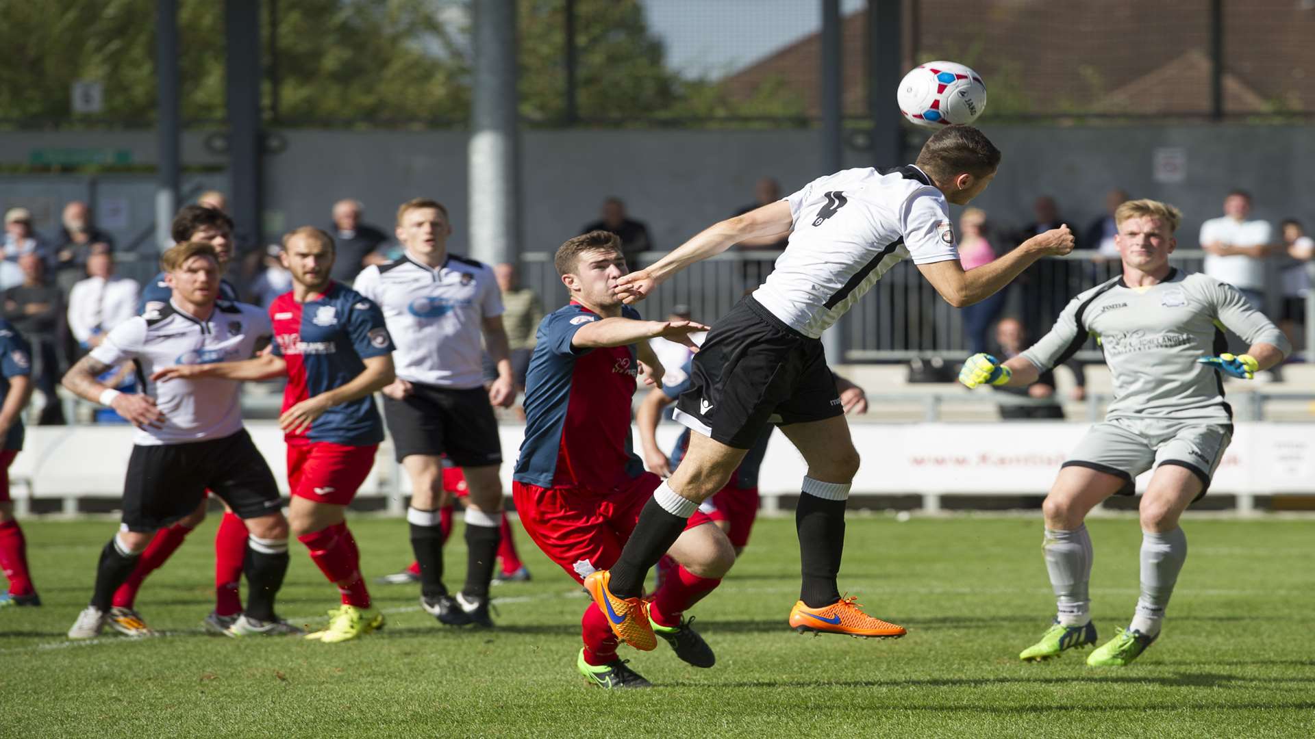 Tom Gardiner heads the ball back across goal for Dartford Picture: Andy Payton