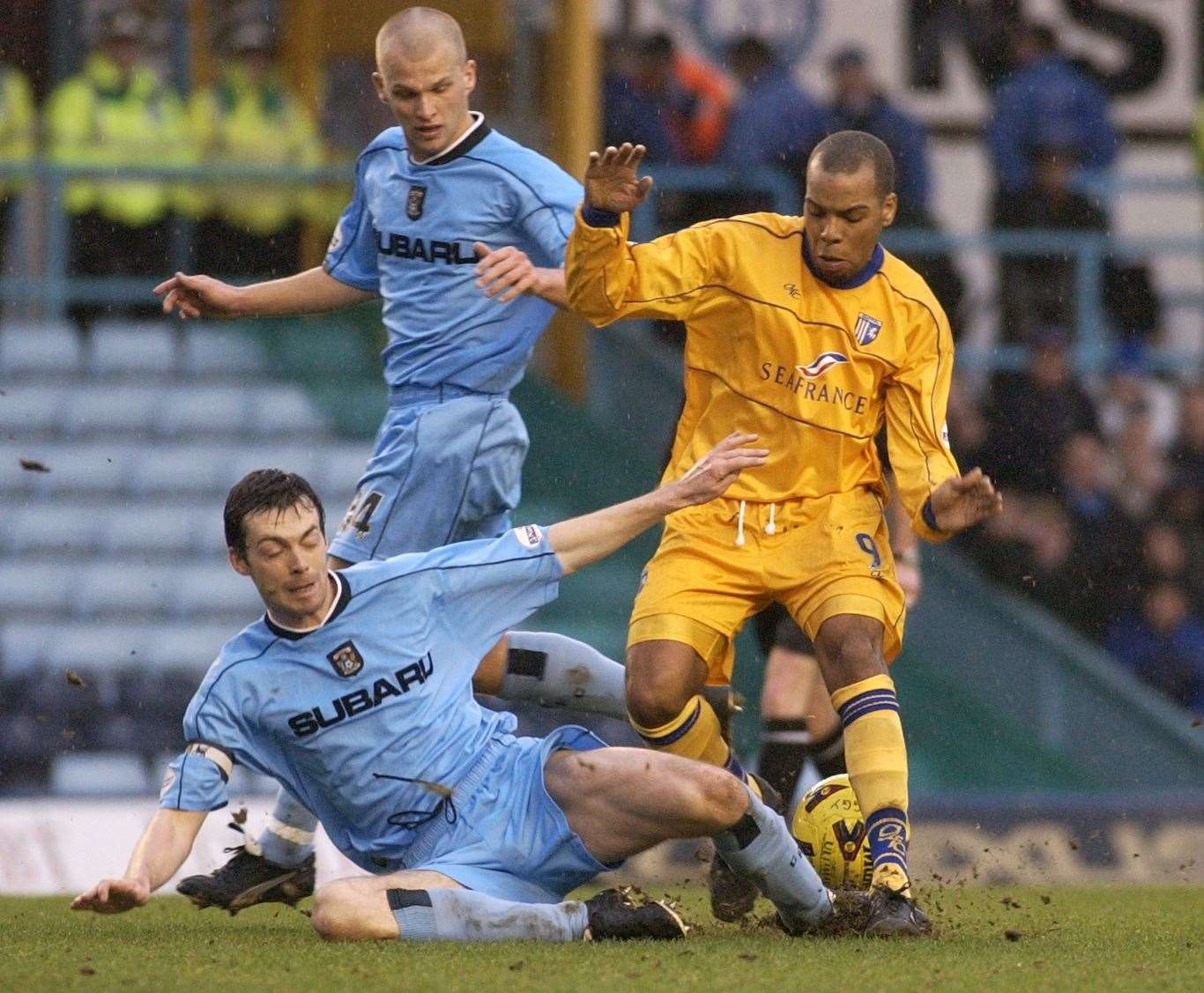Gary Breen in action for Coventry against Gillingham, going to ground to stop Marlon King