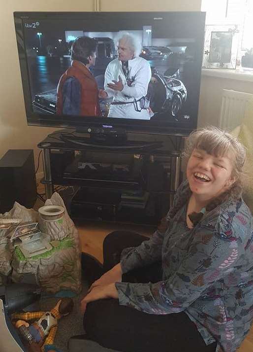Courtney watching the film at her home in Mary Road, Deal