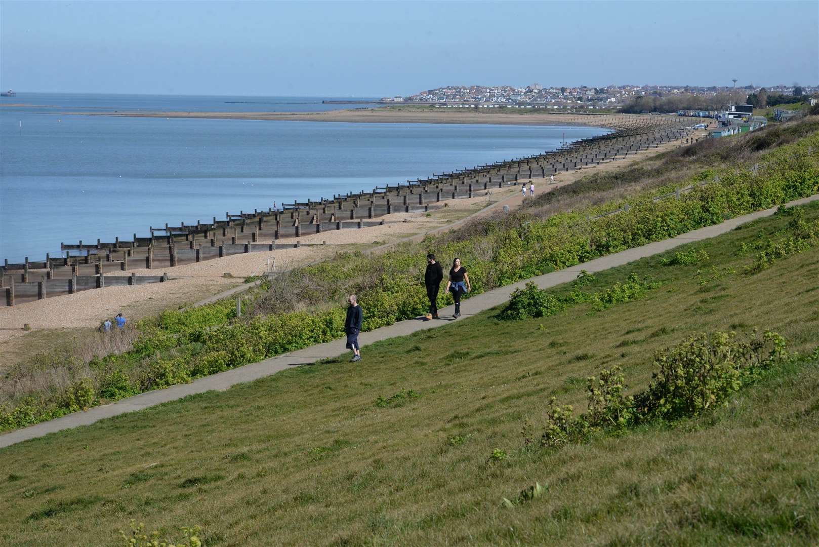 A few people on Tankerton Slopes, Whitstable, on Saturday afternoon, as social distancing allows. Picture: Chris Davey.