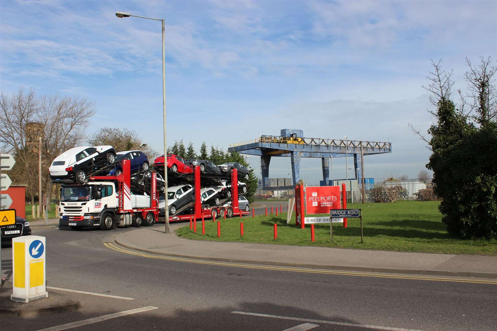 Cars on a transporter leaving Sheerness Docks